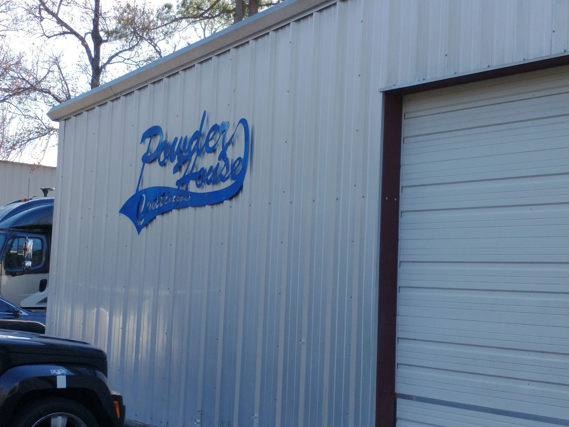 White metal building with blue 