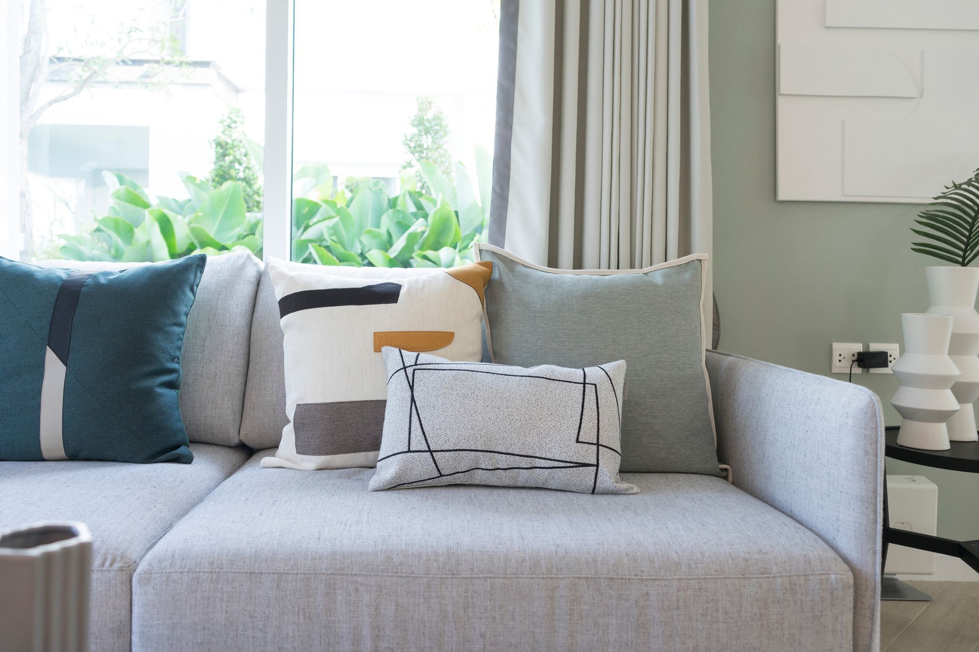 Pillows on the couch in the living room .