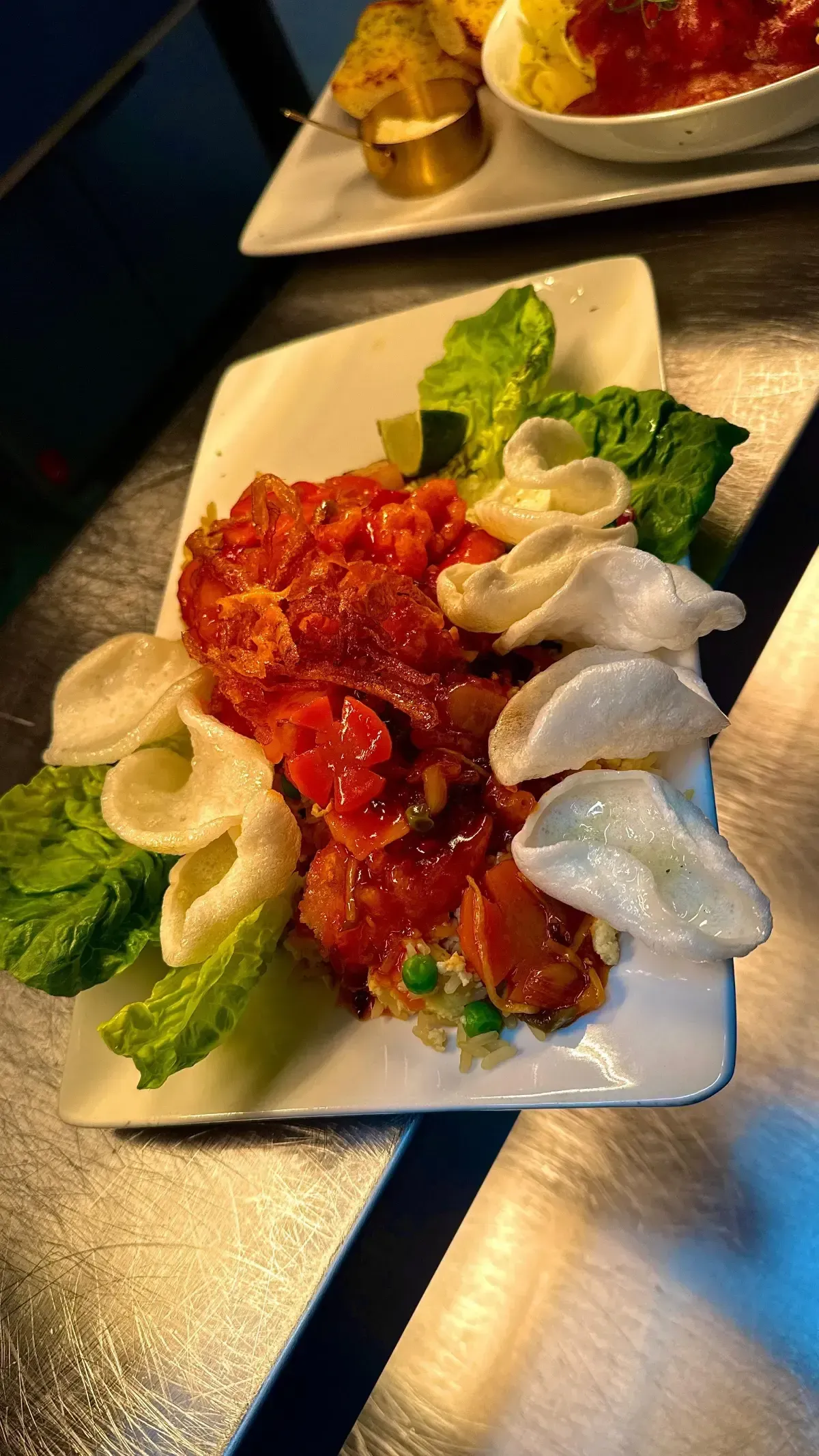 The Mackworth Arms, Laleston, Bridgend | Plate of food with red sauce, lettuce, and crackers. 