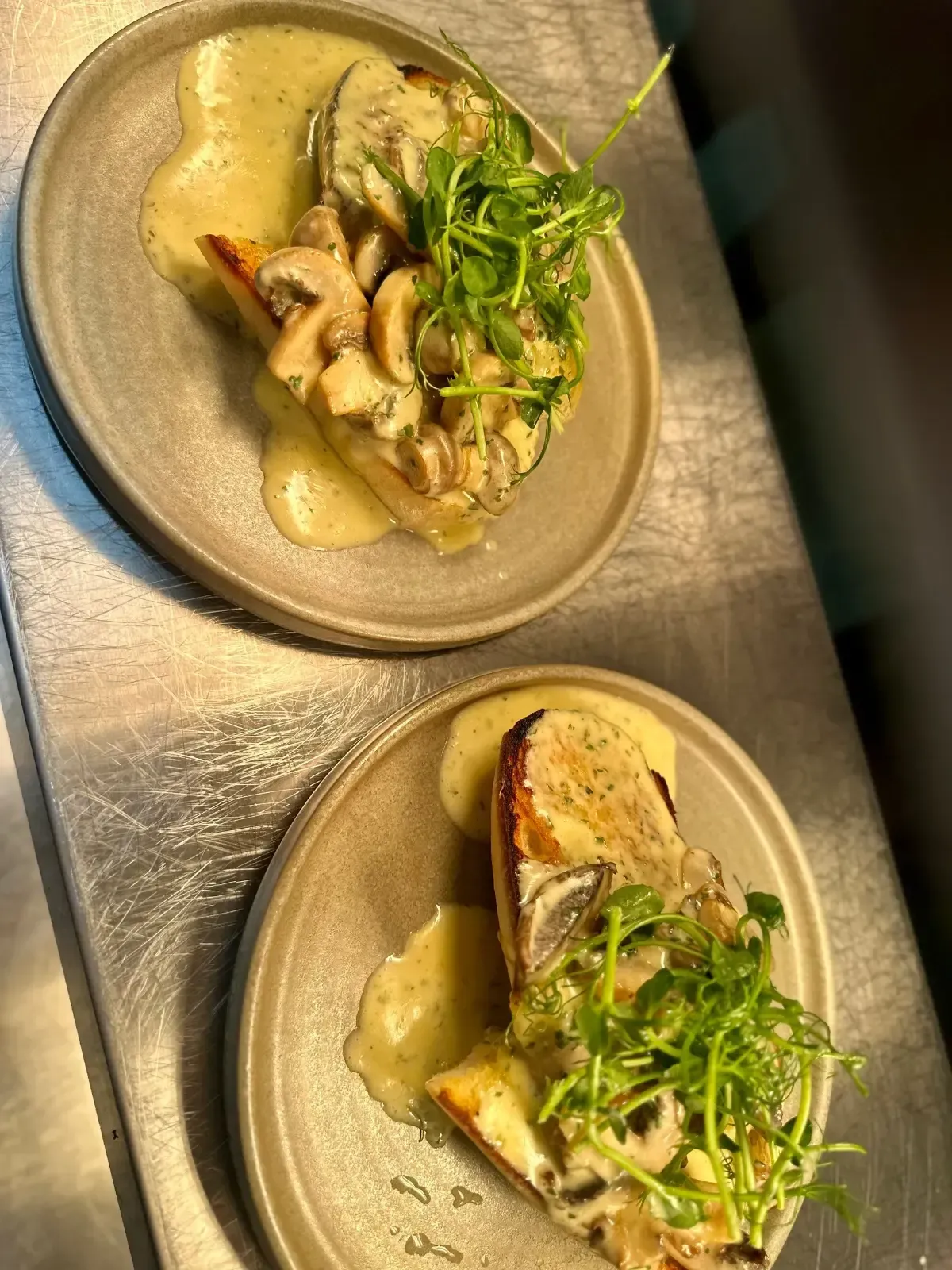 The Mackworth Arms, Laleston, Bridgend | Two plates of mushroom toast with creamy sauce and microgreens.