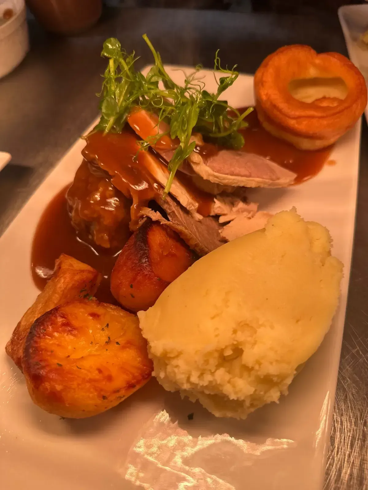 The Mackworth Arms, Laleston, Bridgend | Roast dinner on a white plate: meat, gravy, mashed potatoes, roasted vegetables