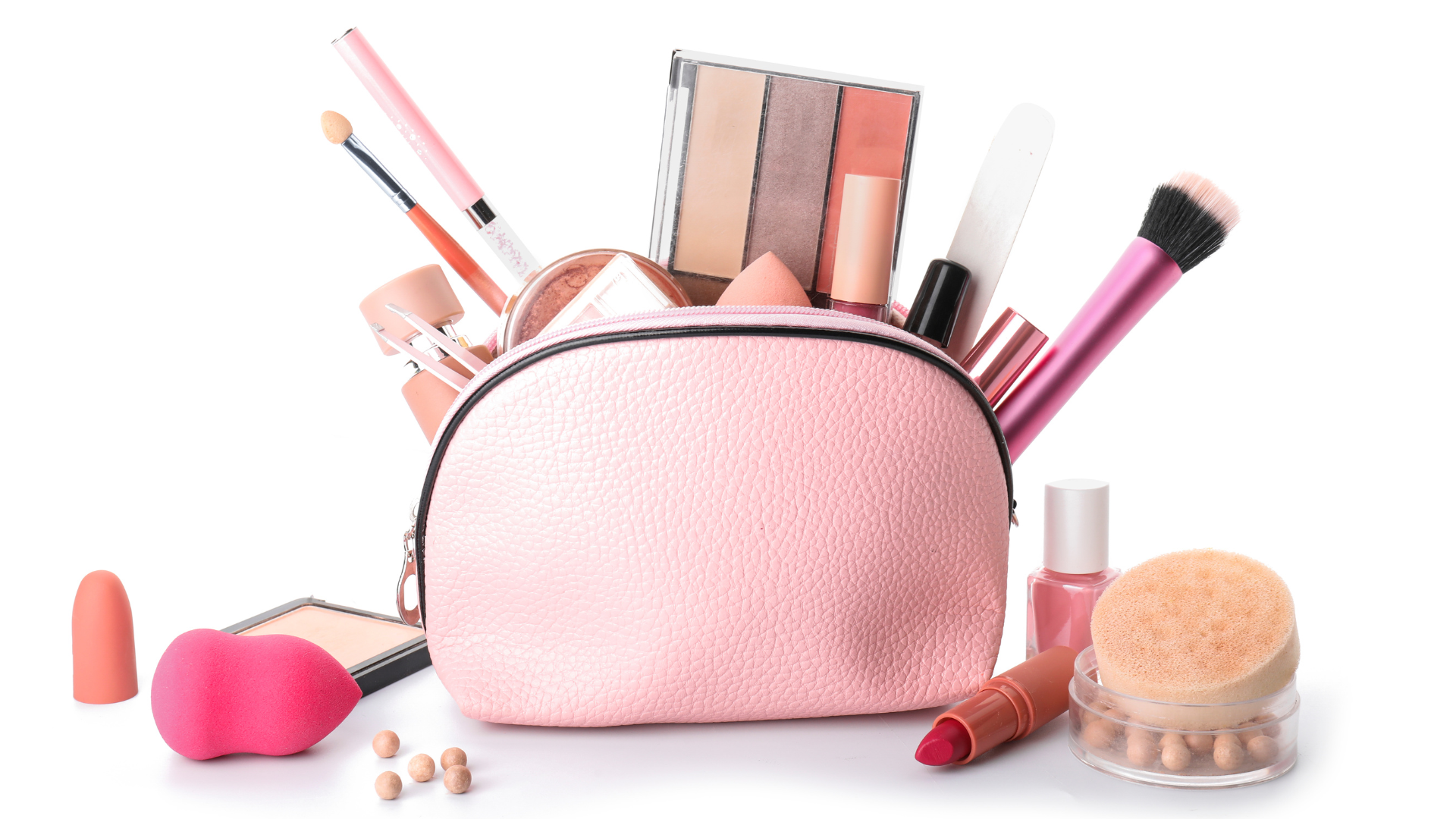 A pink cosmetic bag filled with cosmetics and brushes.