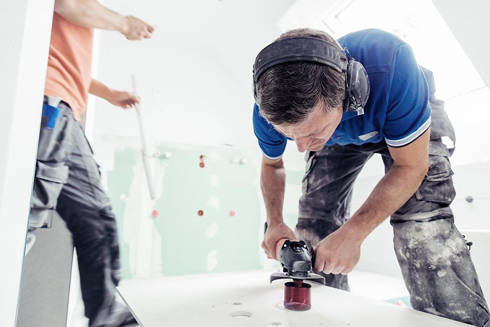 Tiler Cutting Holes In Tiles