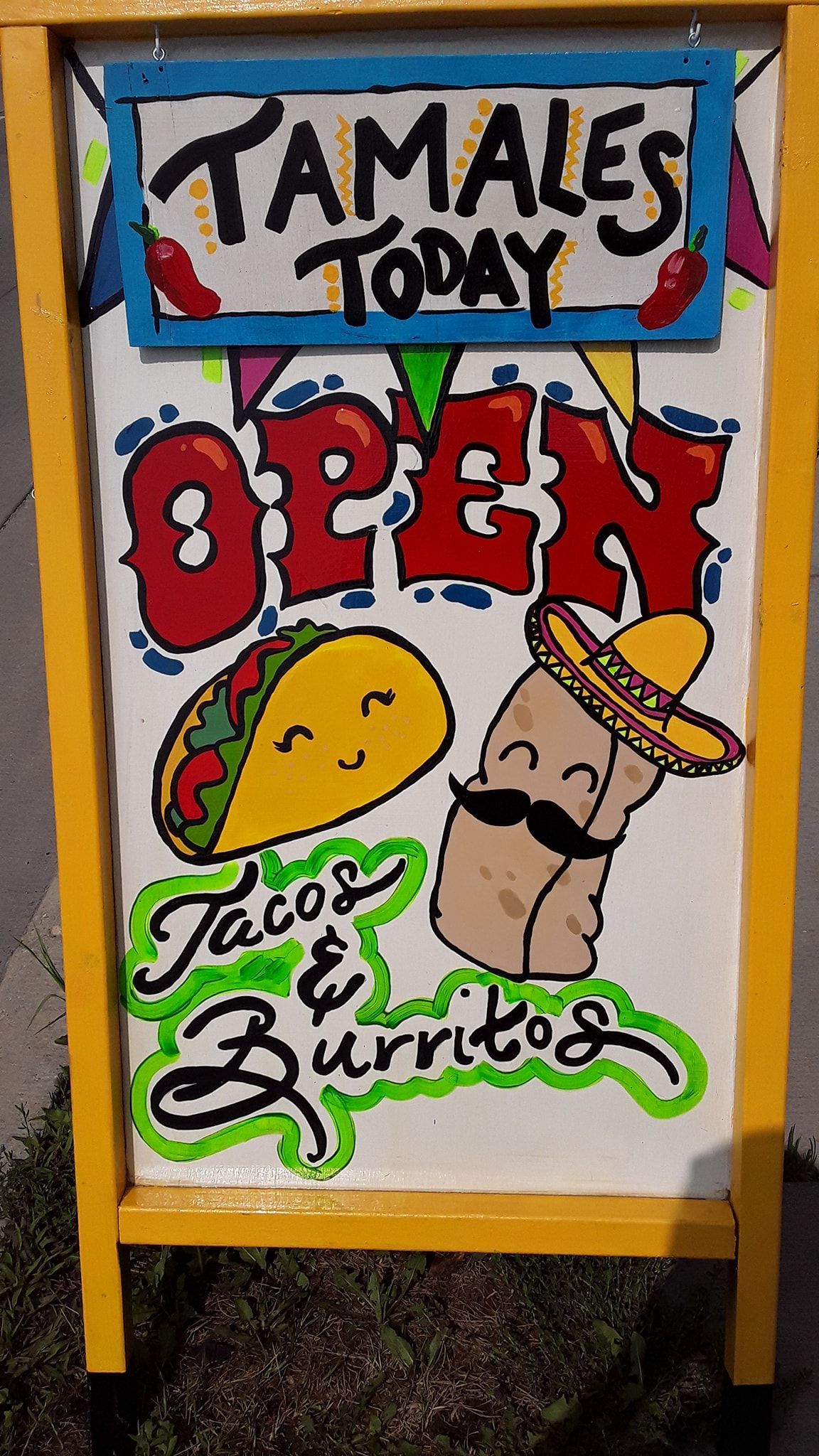 Yellow sandwich board sign: