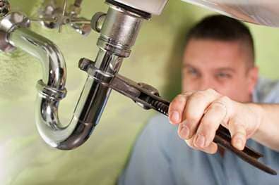 Plumber fixing pipe - plumbing services in Hopkinton, MA