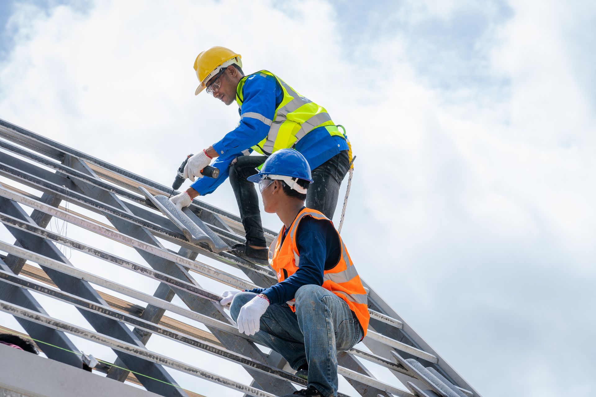 Two men are installing a new roof.