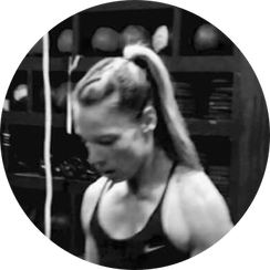 A black and white photo of a woman with a ponytail