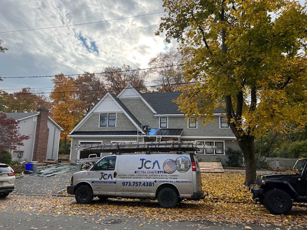 A Company Van is Parked in Front of a House - Newark, NJ - JCA Construction 