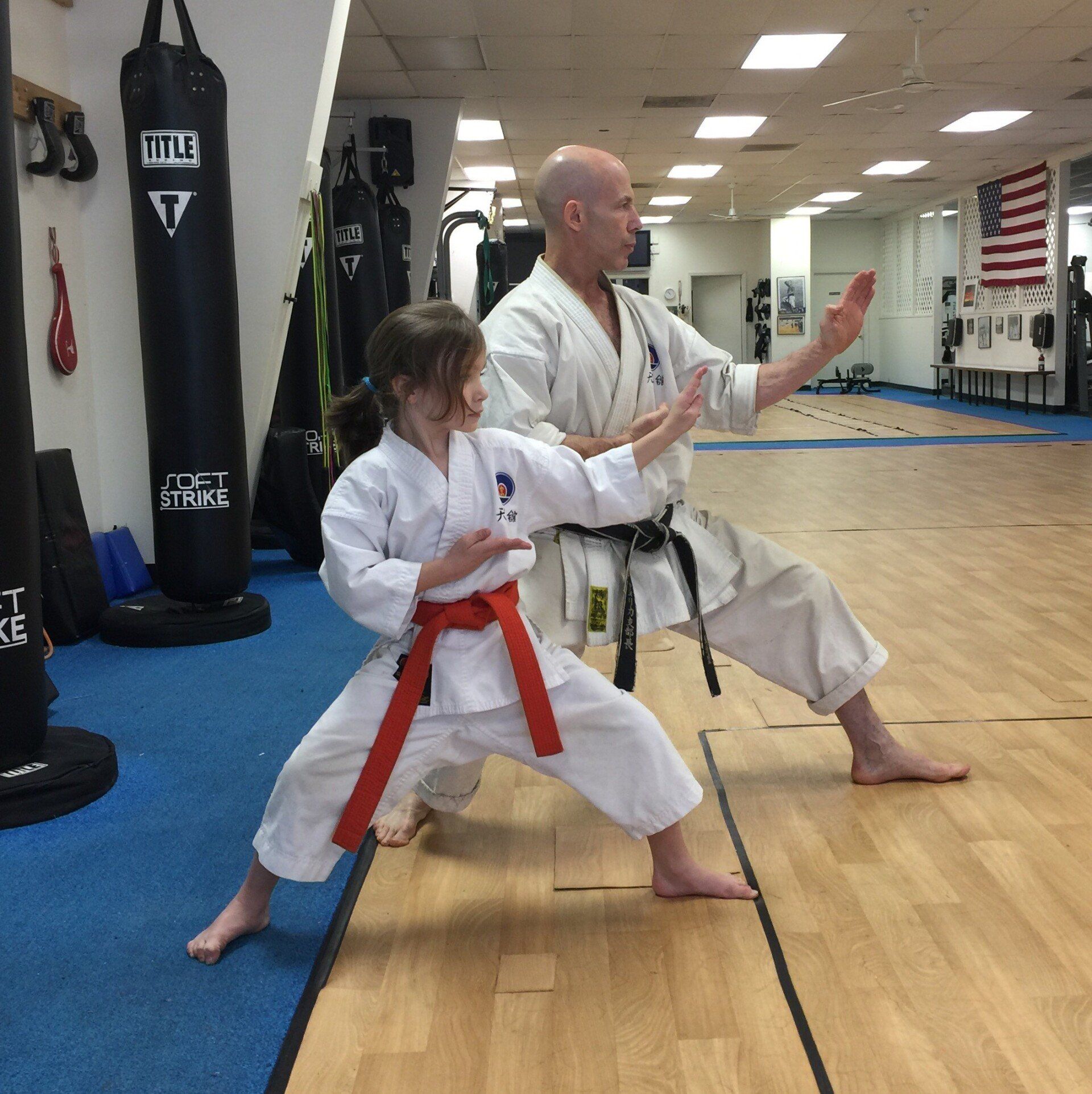 Kid karate student with teacher