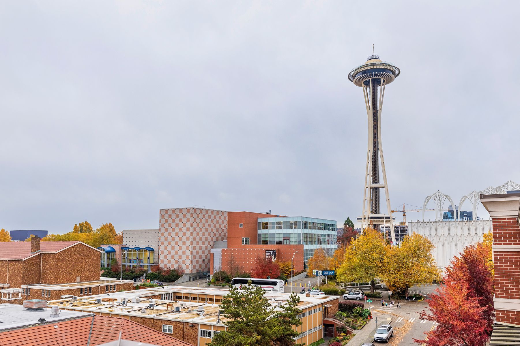 An aerial view of a city with the space needle in the background.