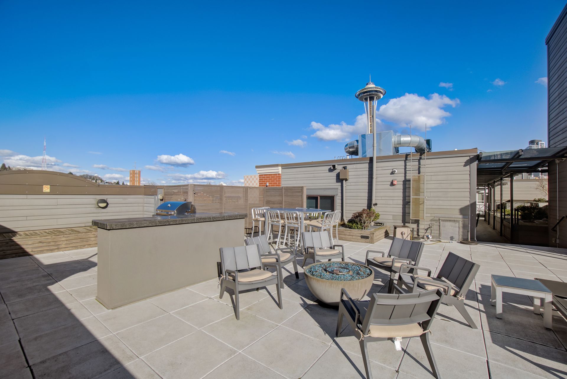 There is a fire pit on the roof of a building.