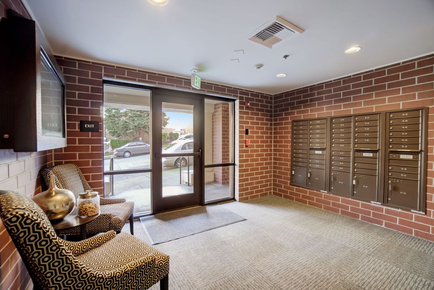 A brick building with a lot of mailboxes in it