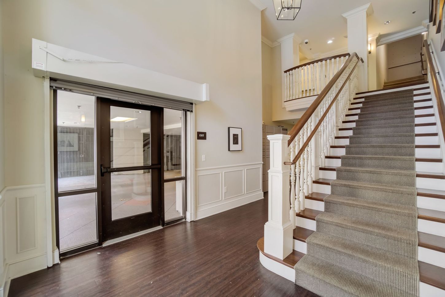 A large hallway with stairs leading up to the second floor.