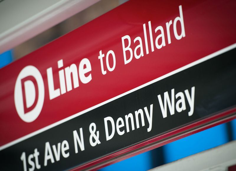 A sign that says line to ballard and 1st ave n & denny way