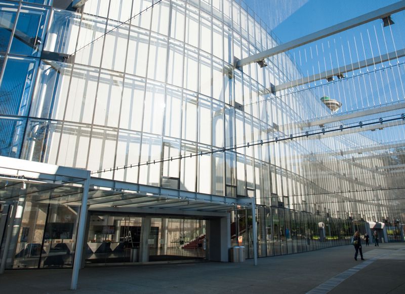A large building with a lot of windows and a canopy.