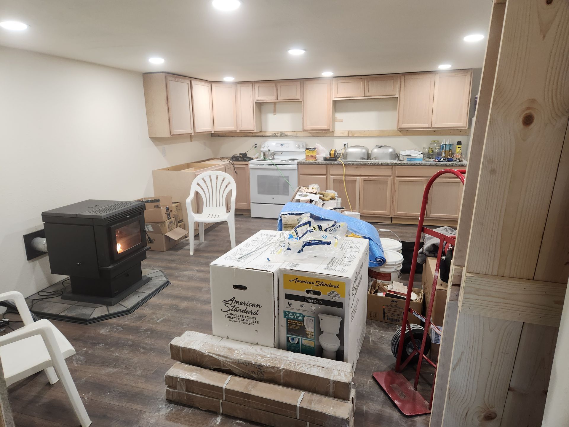 There is a wood stove in the middle of the room.