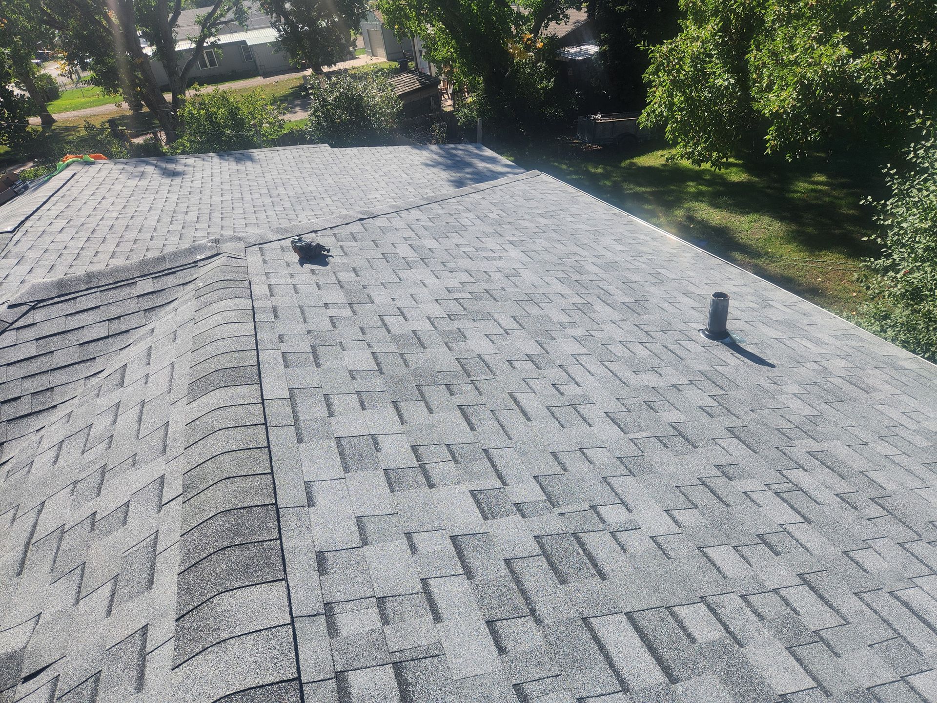 A close up of a roof with shingles on it.