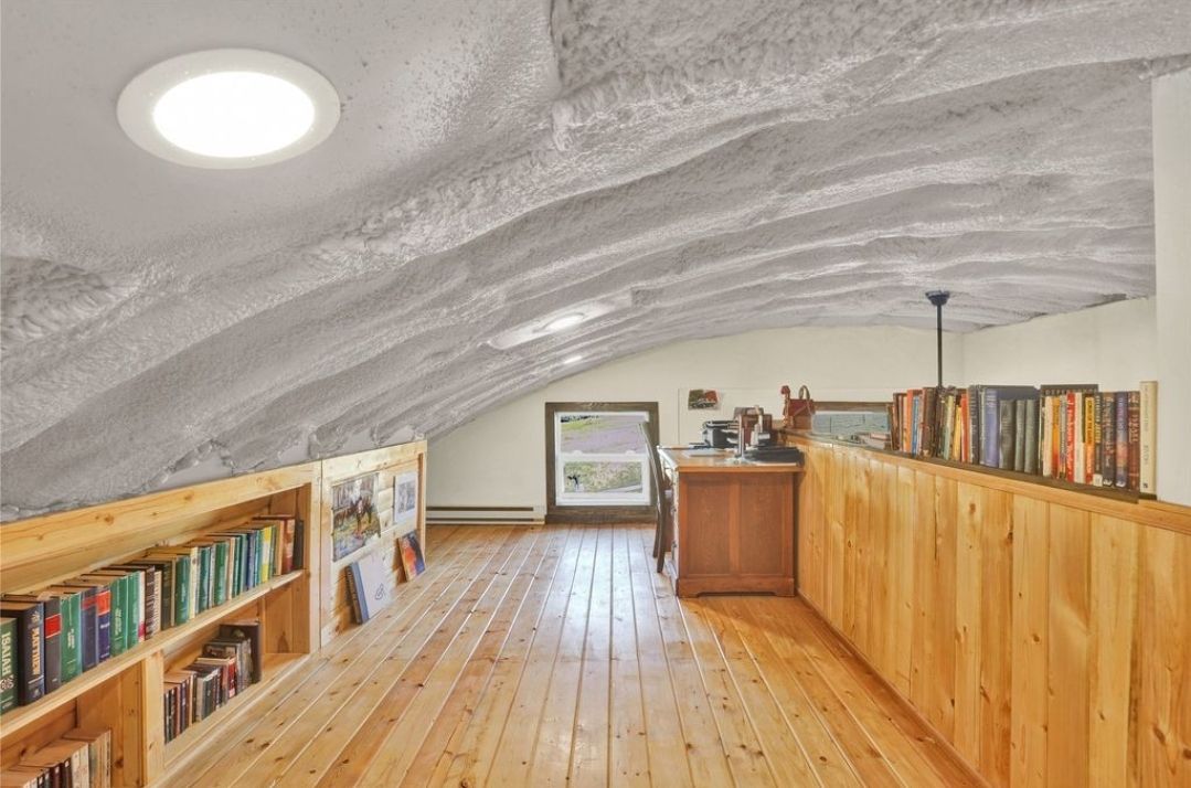 There are a lot of books on the shelves in this room.