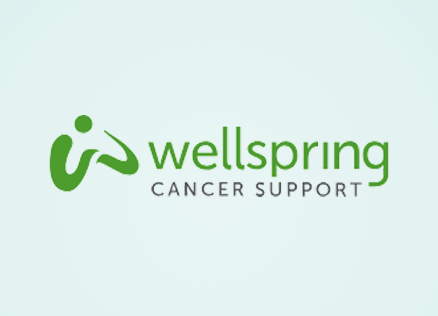 The logo for wellspring cancer support is green and white.
