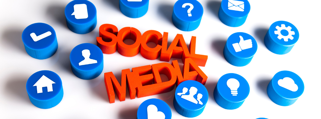 The word social media is surrounded by blue circles and social media icons.