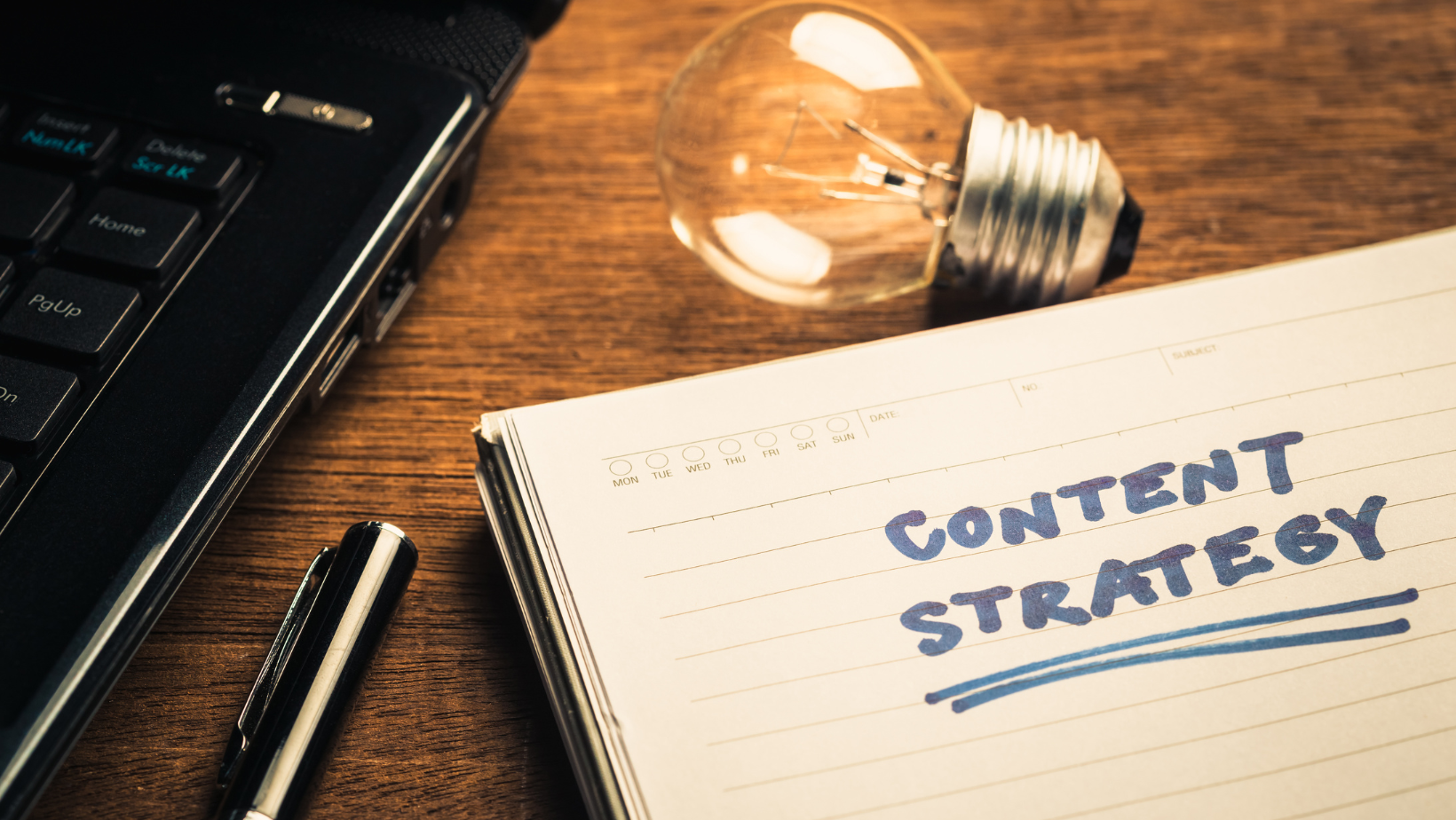 A notebook with the words content strategy written on it