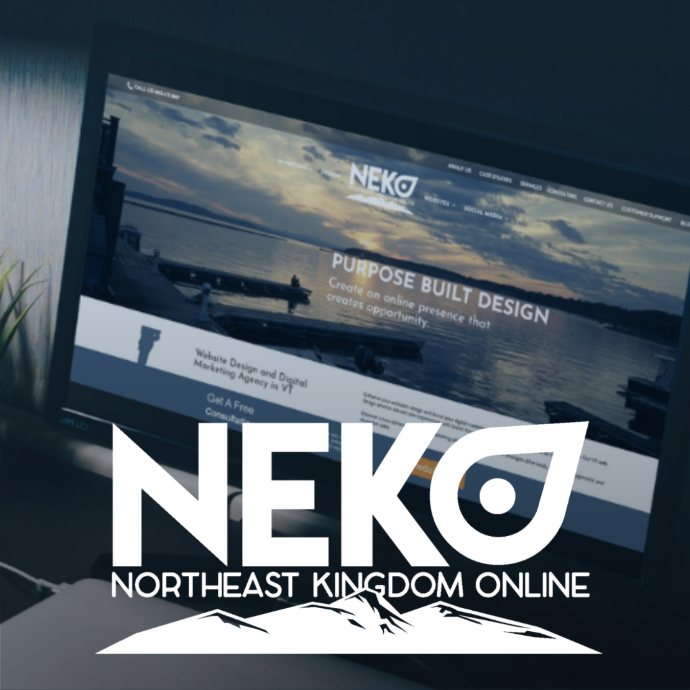 The logo of Northeast Kingdom Online, in front of a computer on a desk with NEKO's home page .