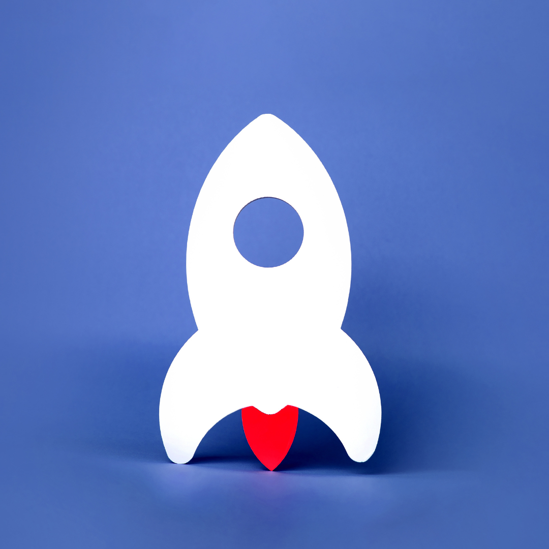 A white rocket with a hole in the middle on a blue background.