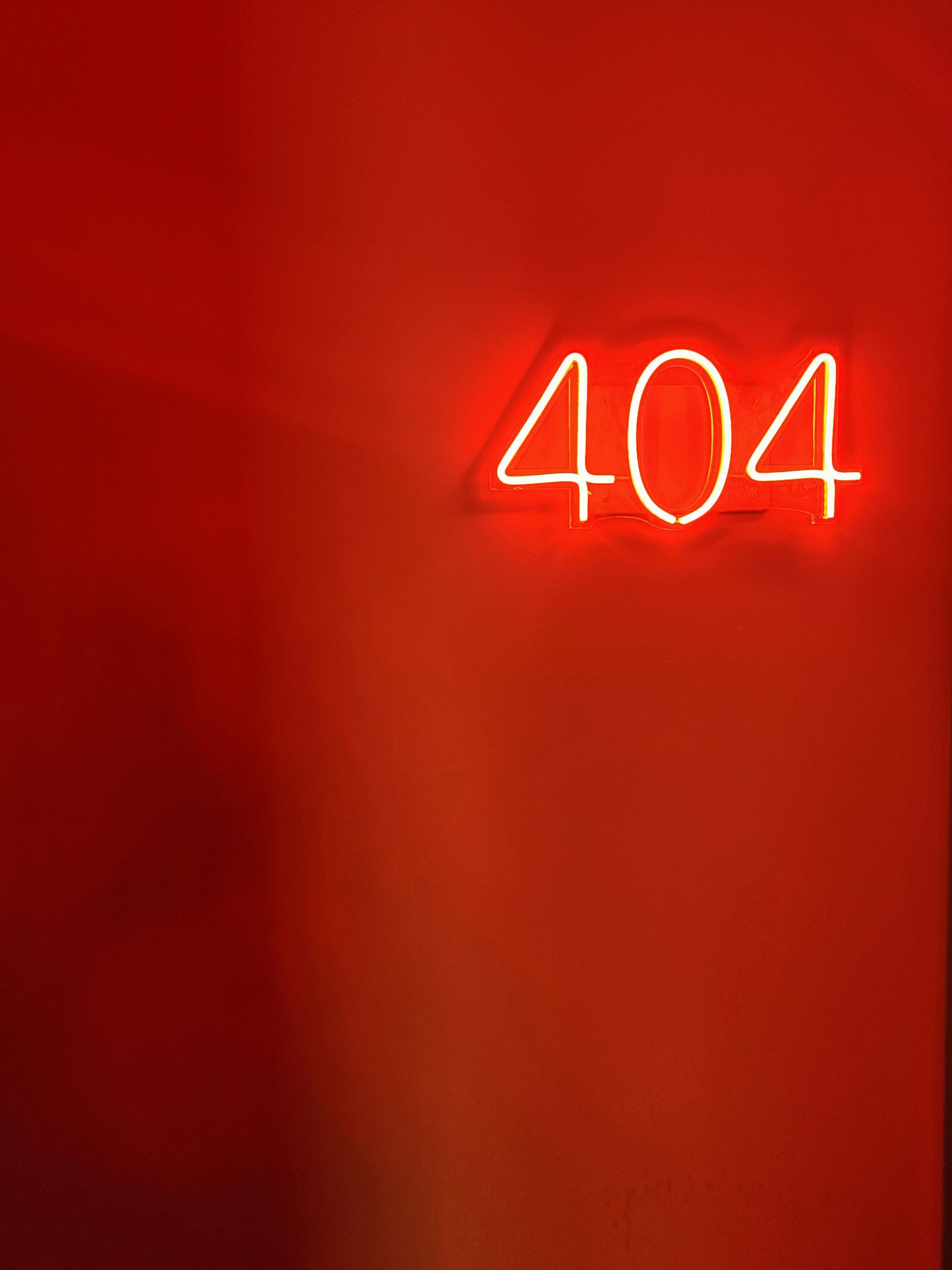 A red, neon, 404 sign, signifying an error.