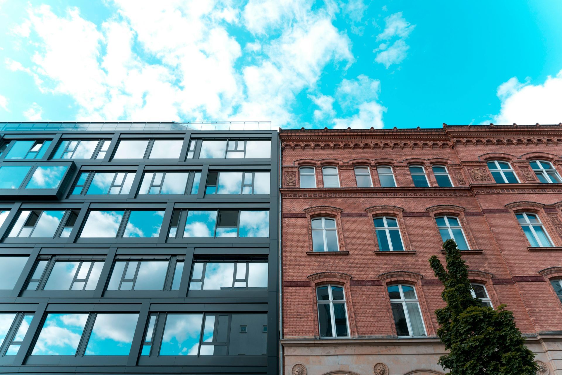 Modern and historic buildings side by side, representing different business styles and approaches.