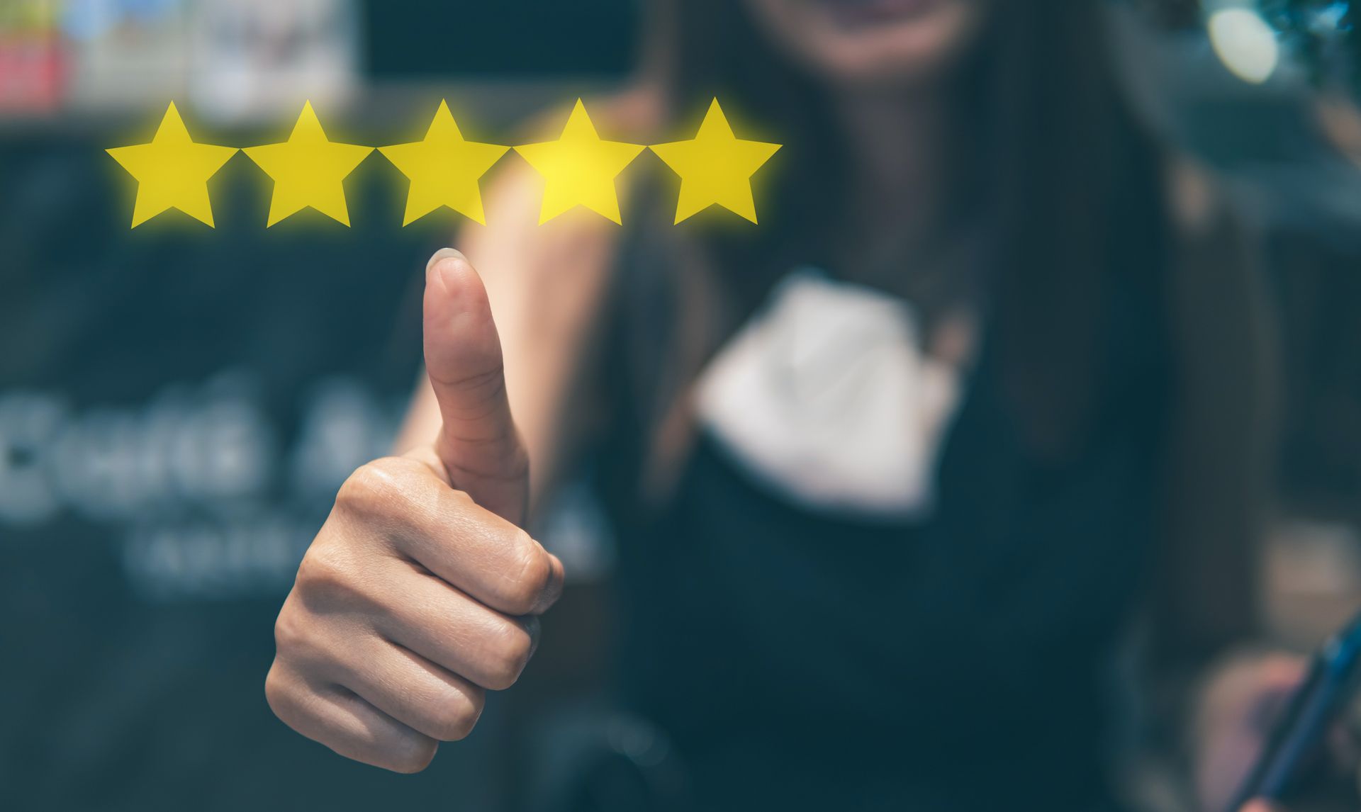 A customer giving a thumbs up overlayed with a five star review.