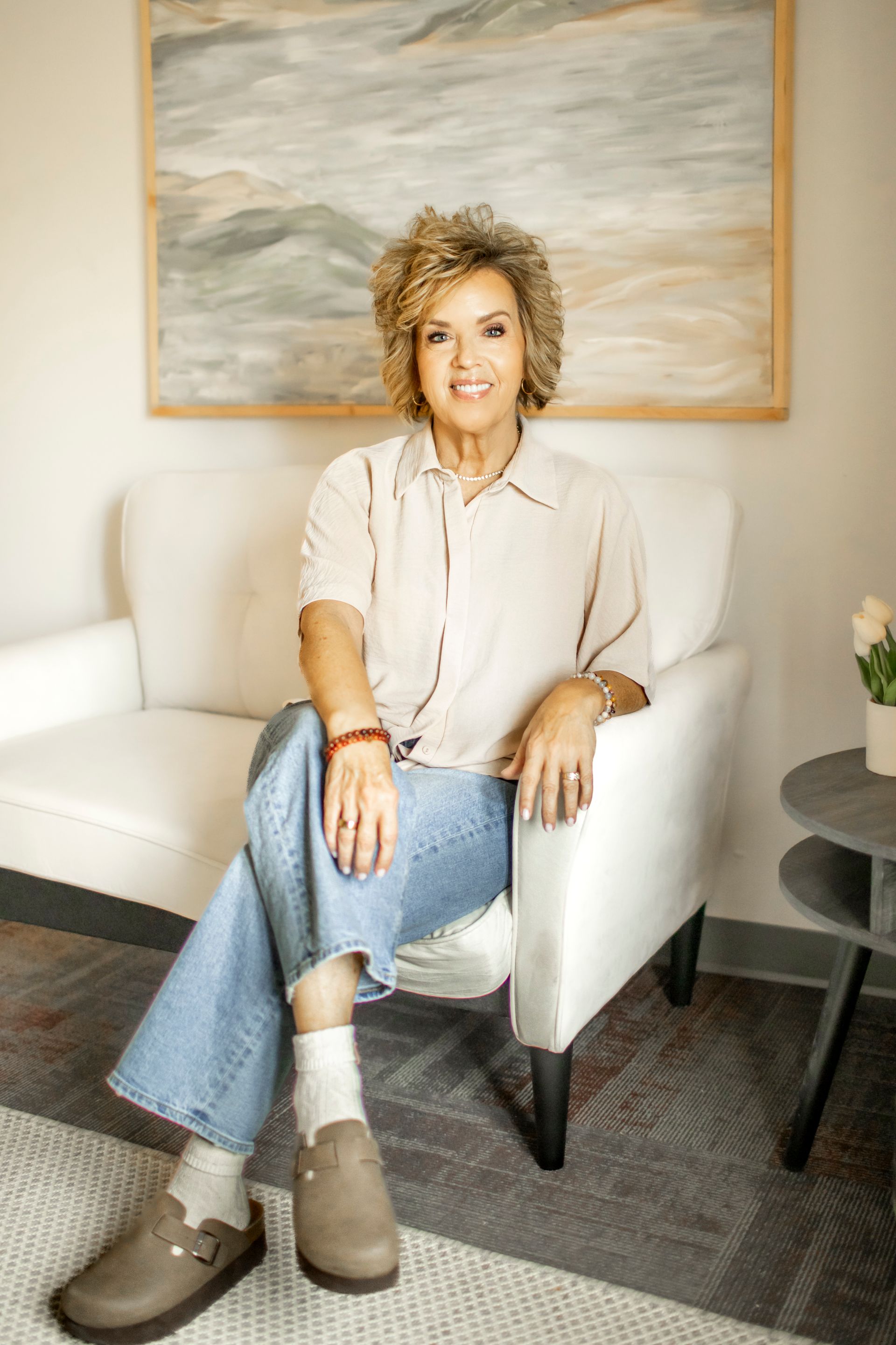 Woman holding paper cutout of digestive system.