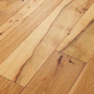 A close up of a wooden floor with a grain and texture.