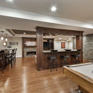 There is a pool table in the middle of the room.