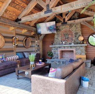 A living room filled with furniture and a fireplace.
