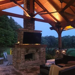 A living room with a fireplace and a flat screen tv.