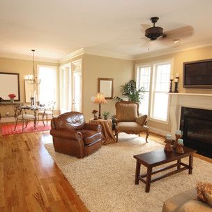 A living room filled with furniture and a fireplace.