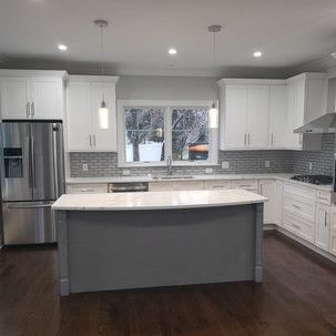 There is a large island in the middle of the kitchen.