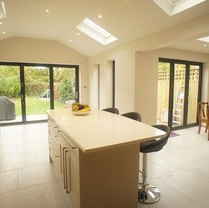 There is a large island in the middle of the kitchen.