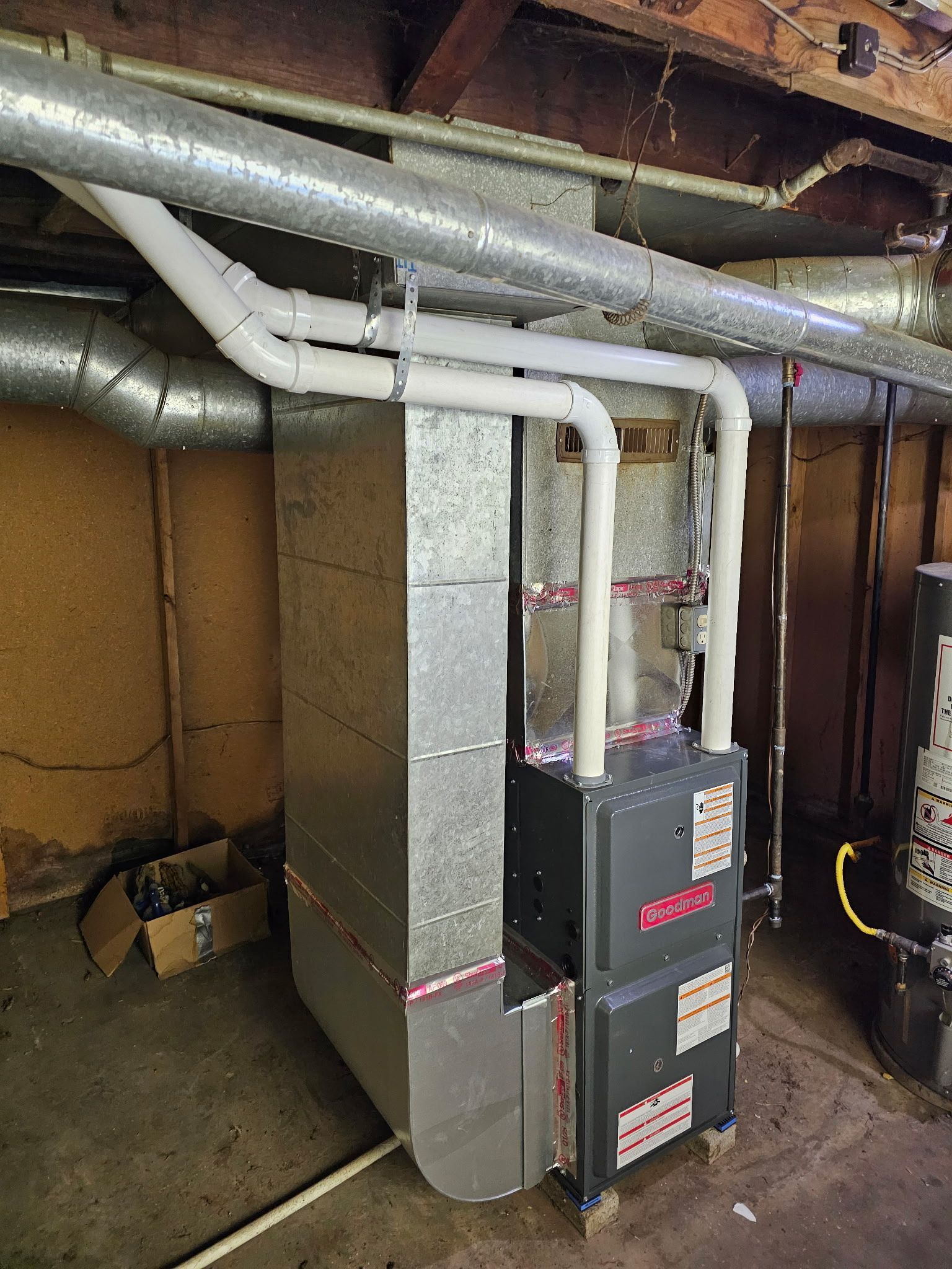 A heating and cooling system is installed in a basement.