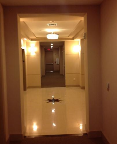 A hallway in a building with a star on the floor