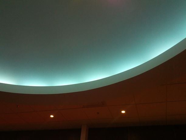 A ceiling with a blue light coming out of it