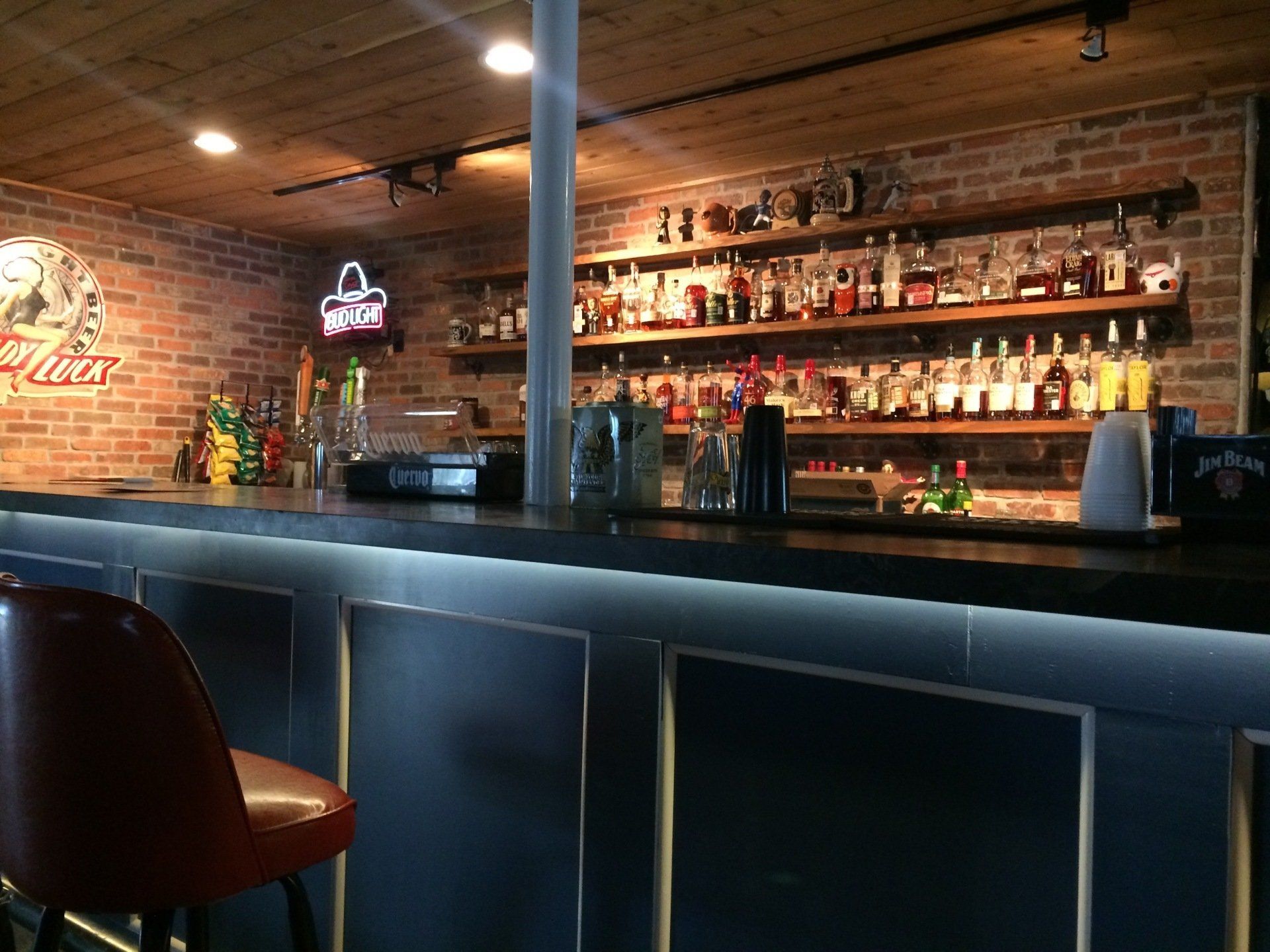 A bar with a sign that says budweiser on it