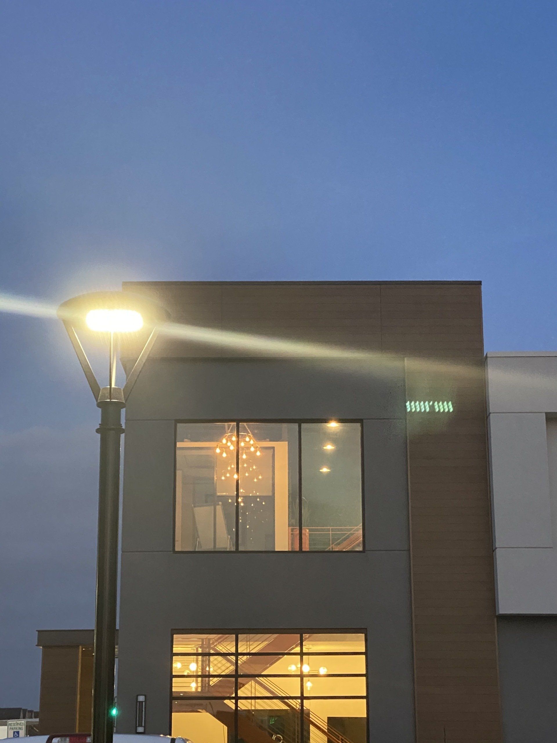A building with a lot of windows and a street light in front of it