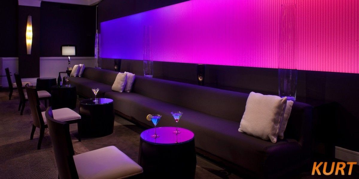 A room with purple lights and the word kurt on the bottom