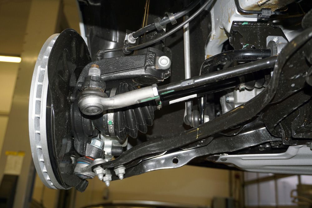 A Close up Of the Underside of A Car with A Brake Disc — Rasmussen Mechanical & Tyres in Garbutt, QLD