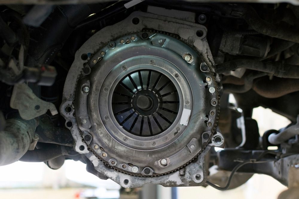 A Close up Of a Clutch on The Underside of A Car — Rasmussen Mechanical & Tyres in Garbutt, QLD
