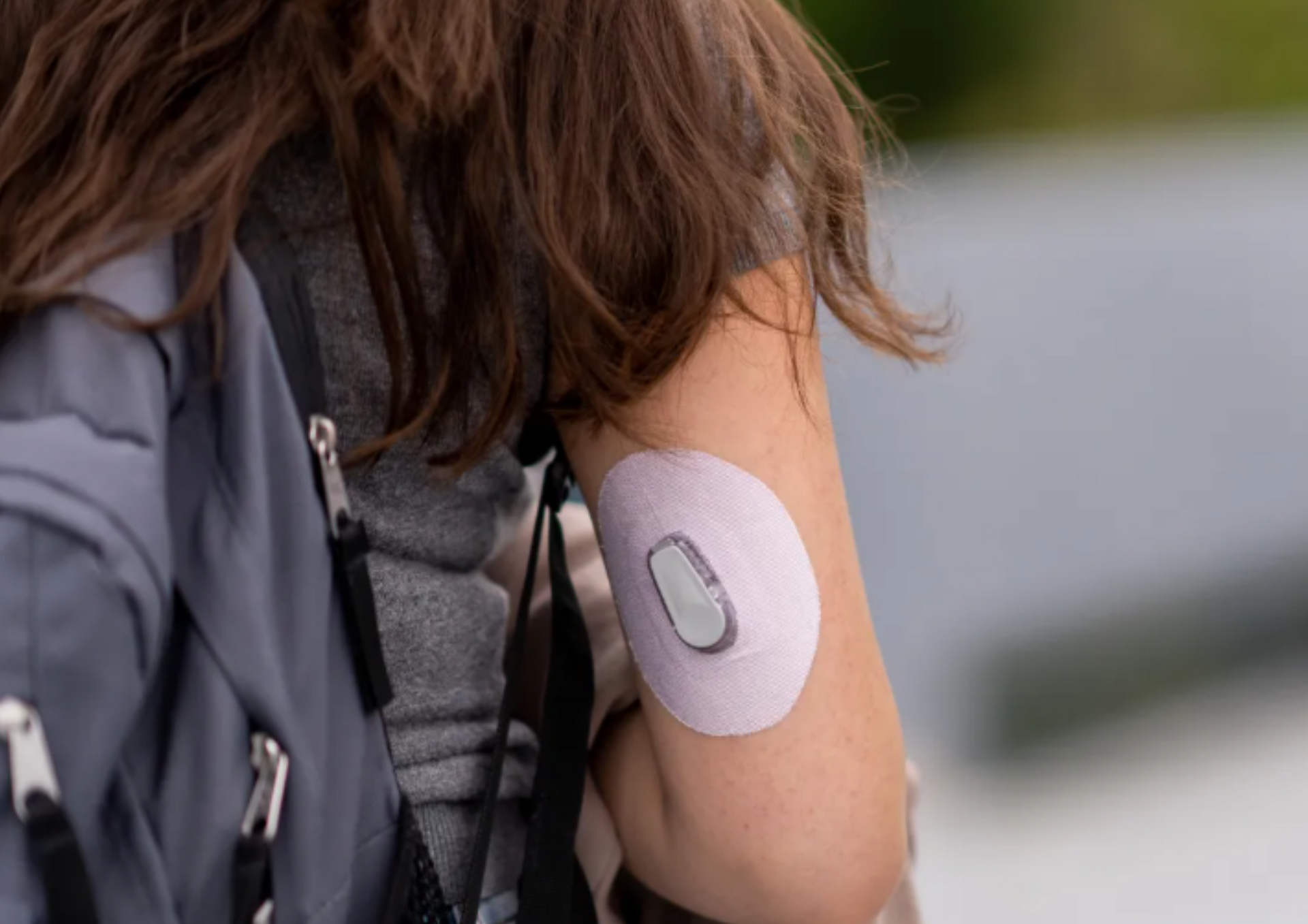 A woman with a patch on her arm.