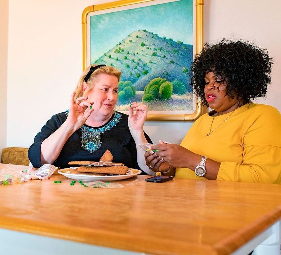 2 women sitting at a table