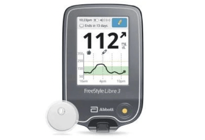 A freestyle libre 3 glucose meter with a glucose sensor attached to it.