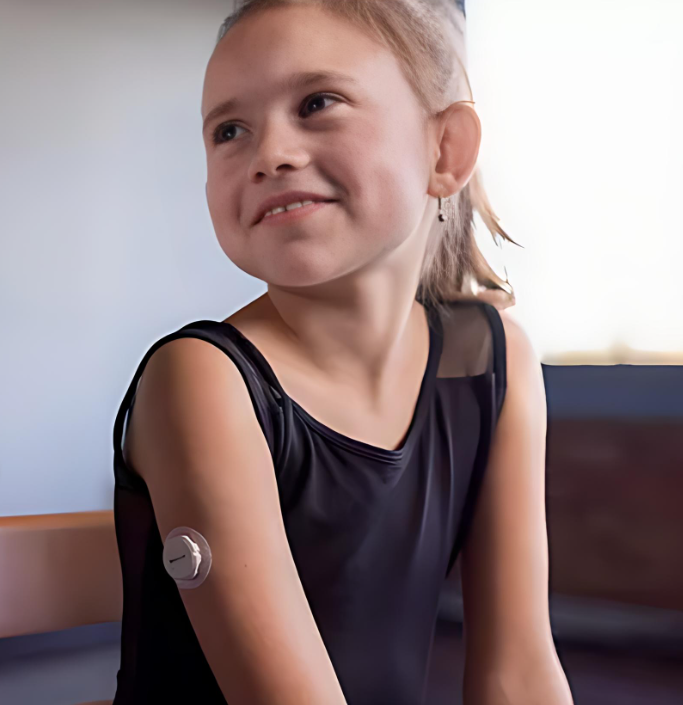 A young girl with a device on her arm